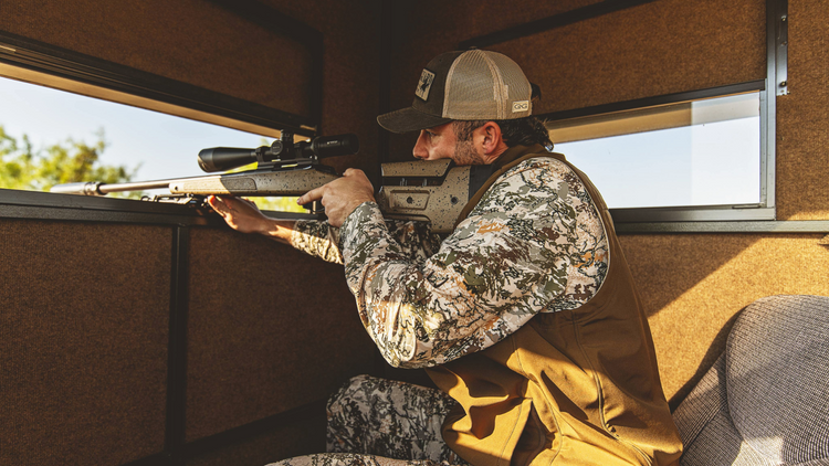 MEN'S HUNTING. Hunter lines up a shot in GameGuard Digital long sleeve shirt, MeshBack Cap, and Guía Grande Vest. Men’s hunting apparel, concealment camo, waterproof hunting vest, moisture-wicking shirt, UPF 50+, durable outdoor gear, GameGuard fieldwear.