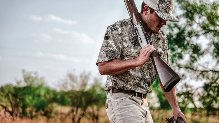 HUNTING SHIRTS. Hunter wears GameGuard short sleeve Original Shirt in cactus camo with MeshBack Cap. UPF 50+ hunting shirt, vented, stain-resistant, quick-dry outdoor apparel, performance field shirt, western camo gear, breathable moisture-wicking shirt.