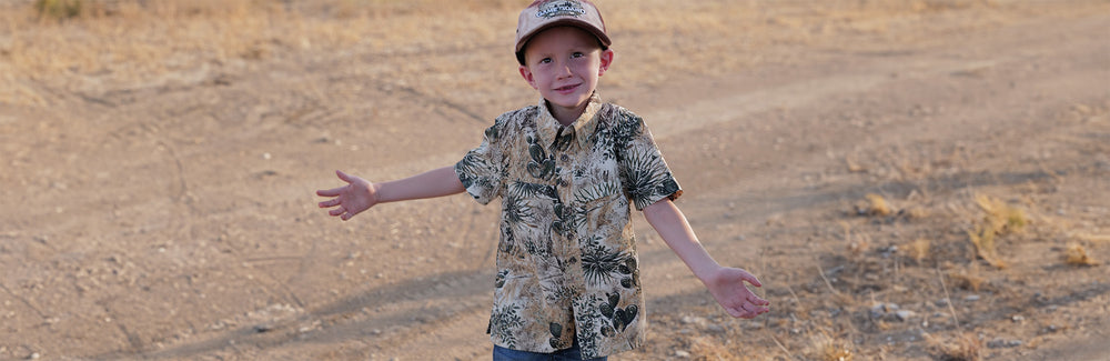 child wearing Youth GameGuard MicroFiber Shirt outside with stain resistance