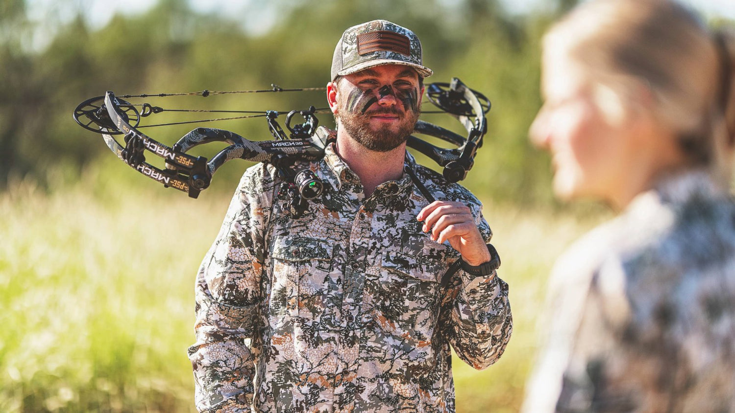 GAMEGUARD DIGITAL CAMO. Bowhunter wears GameGuard Digital Camo shirt and cap. Lightweight hunting shirt, camo apparel, concealment gear, archery shirt, UPF 50+, quick-dry performance, moisture-wicking, field-tested camo, outdoor hunting clothing.