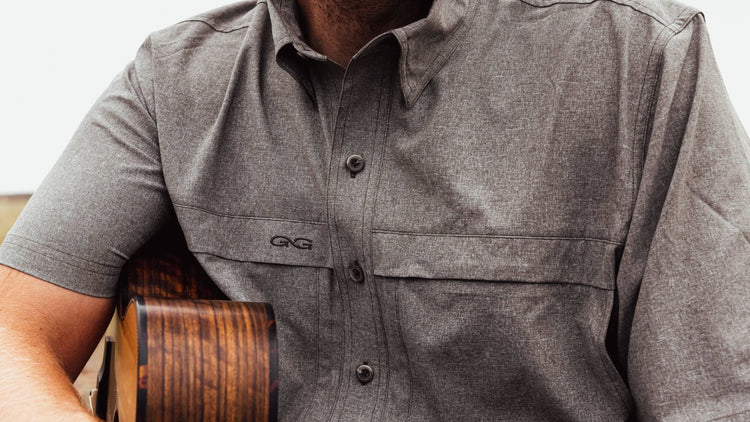 MICROTEK SHIRT. Close-up of GameGuard MicroTek Shirt featuring sleek design and chest pockets. Lightweight MicroFiber, mechanical stretch, UPF 50+, quick-dry, moisture-wicking, stain-resistant, outdoor shirt, GameGuard performance apparel, active fit.