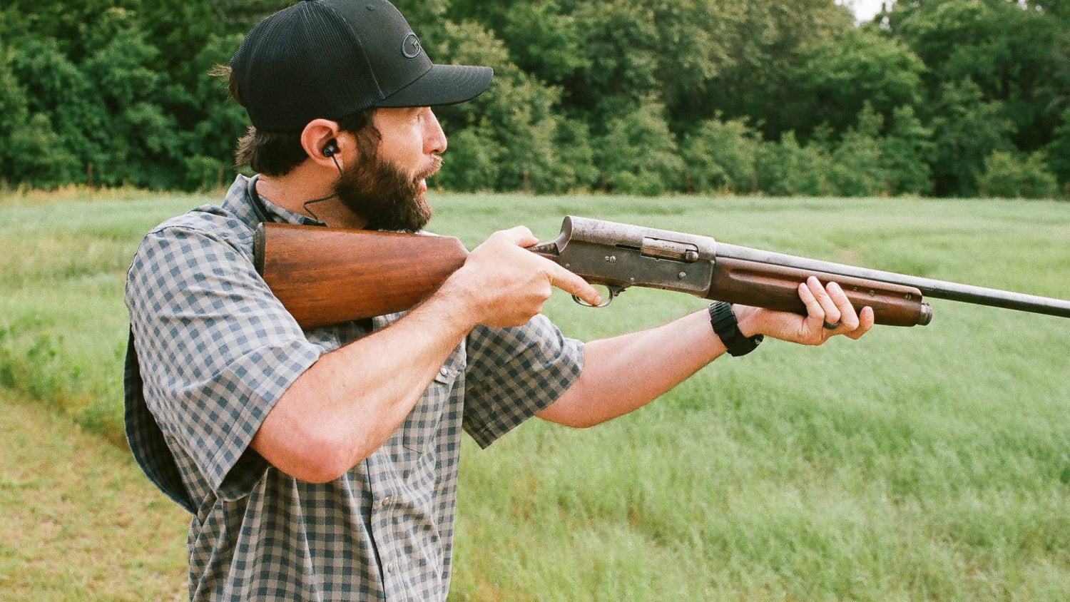 SHORT SLEEVE PEARL SNAP. Outdoorsman aims shotgun in GameGuard Short Sleeve Pearl Snap Shirt. Western snap shirt, lightweight MicroFiber, UPF 50+, mechanical stretch, stain-resistant, breathable hunting shirt, GameGuard fieldwear, classic ranch apparel.