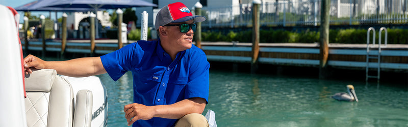 man standing on boat to fish wearing GameGuard HydroBlue MicroFiber Shirt