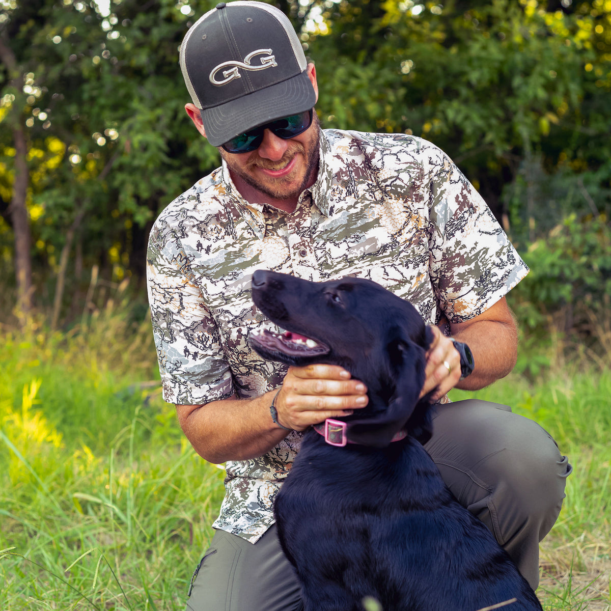 Man with dog in the woods wearing GameGuard Digital Camo Explorer Shirt for men