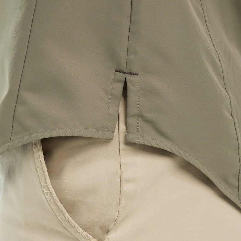 Load image into Gallery viewer, Close-up of the bottom part of the Mesquite Ladies&#39; Shirt, showing the side vent and microfiber fabric in green.
