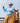 Man on horseback holding a lasso against a clear sky