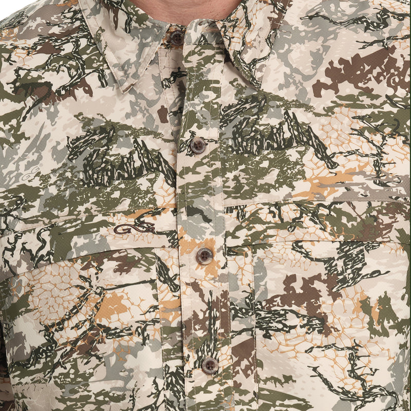 Load image into Gallery viewer, lose-up of the front of the GameGuard Explorer Shirt (long sleeve), showing the buttoned collar and chest pocket with a digital camouflage pattern.
