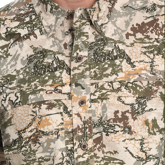 lose-up of the front of the GameGuard Explorer Shirt (long sleeve), showing the buttoned collar and chest pocket with a digital camouflage pattern.