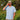 Man enjoying a drink outdoors relaxed wearing RainWater Blue Camp Shirt.