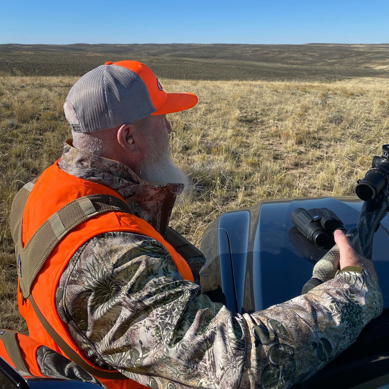 Man hunting wearing gameguard blaze cap with steel meshback