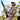 Man holding shotgun on hip looking to the sky wearing GameGuard MicroFiber and GameGuard cap