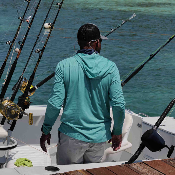 fishing wearing dorado gameguard defender hoody enjoying outdoors