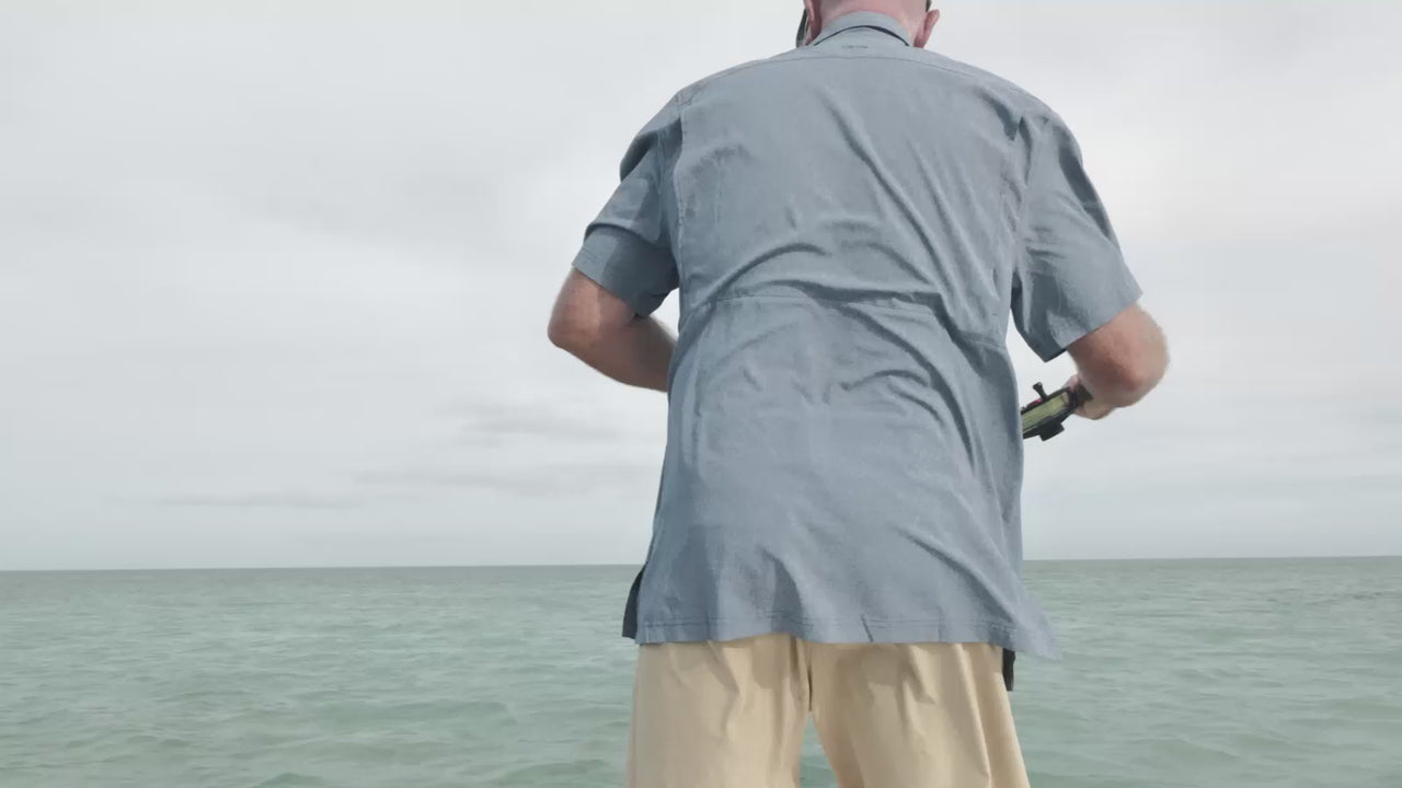 Man casting line while fishing with ease and without pinching in his shirt because of Mechanical Stretch in GameGuard Shirts, including the Deep Water MicroTek Shirt.